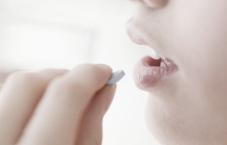 Woman taking medication